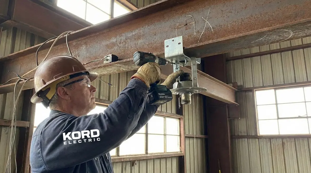 Commercial ceiling fan installation process in a large warehouse