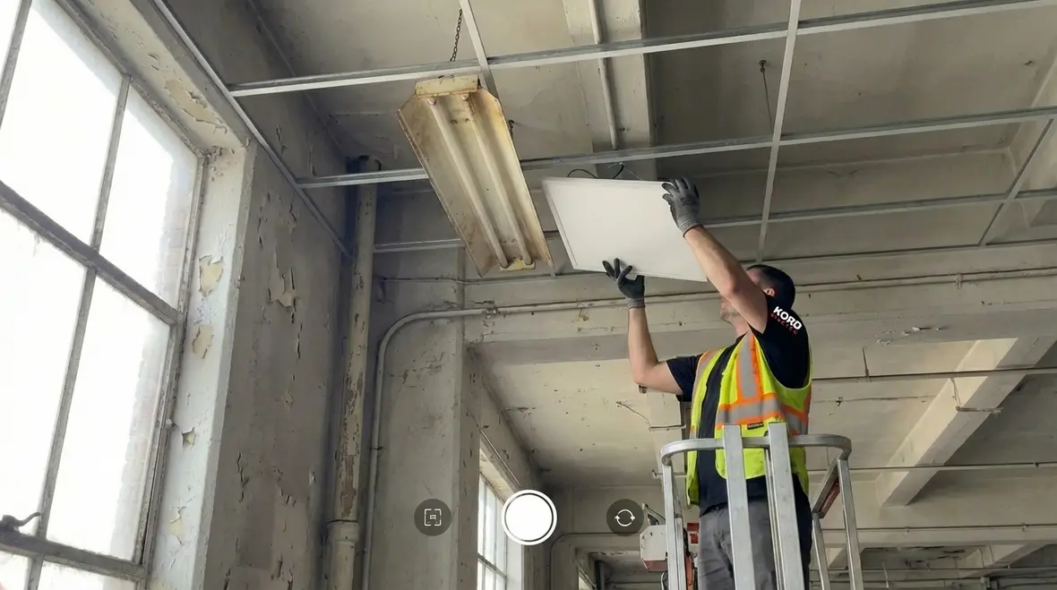 Close up of commercial emergency lighting fixtures and exit sign components
