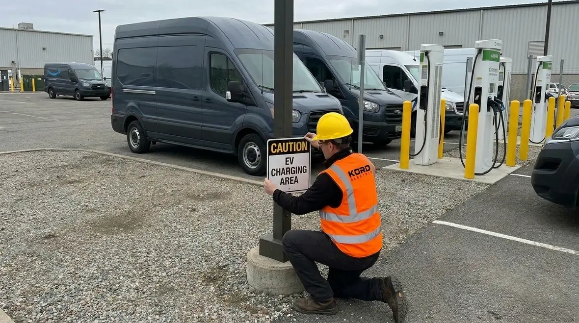 Engineers reviewing EV fleet charger sizing and circuit design