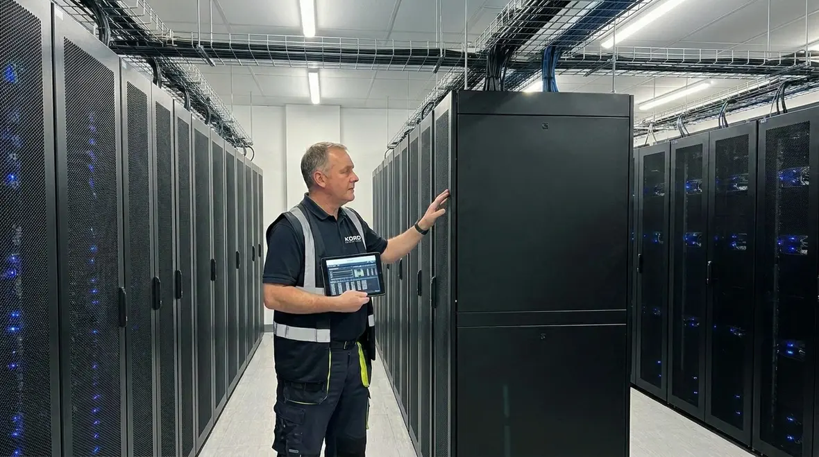 Technicians reviewing critical loads and power paths in a data center
