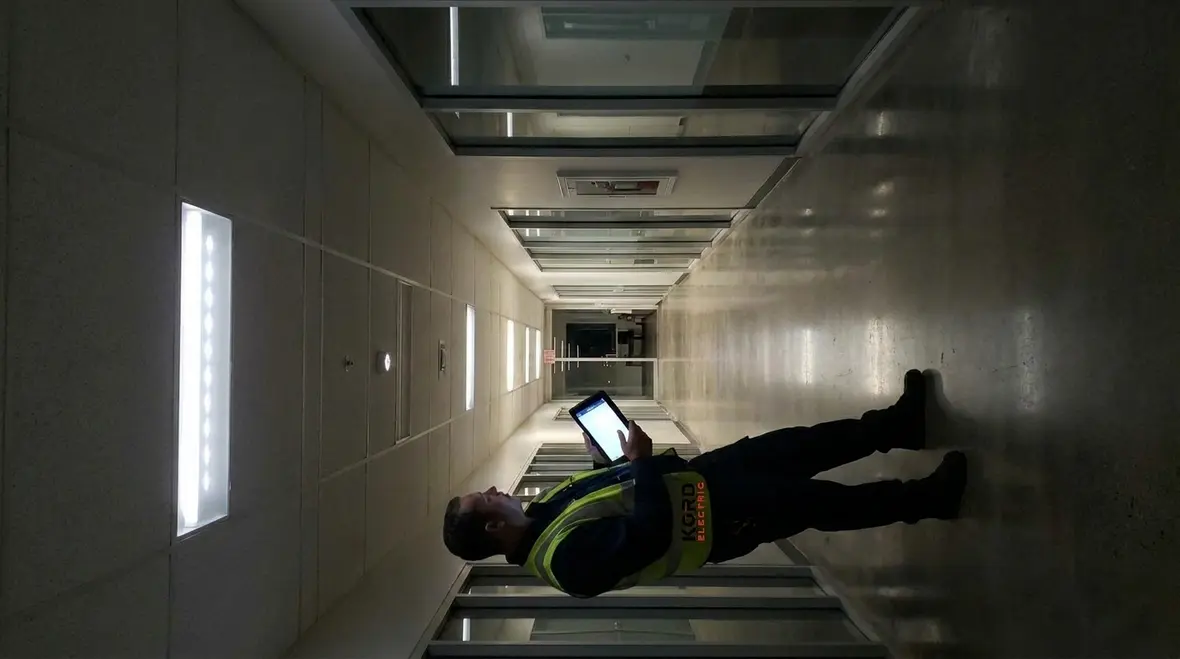Technicians reviewing power quality data for a large commercial building