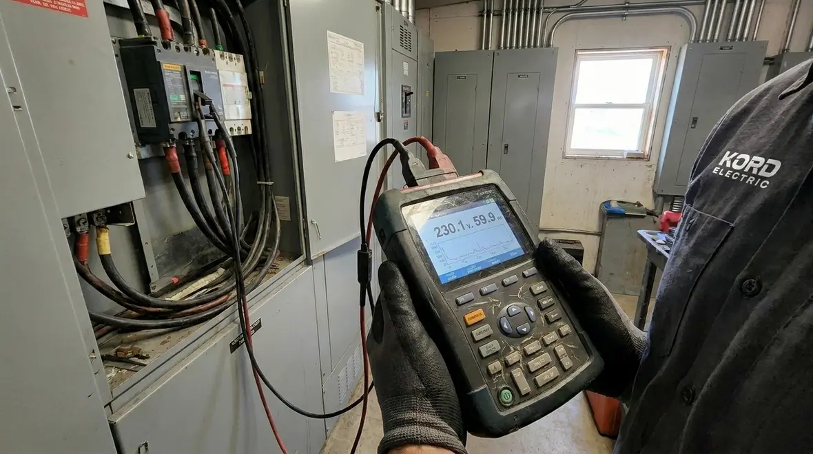 Kord Electric technicians reviewing commercial electrical load testing data