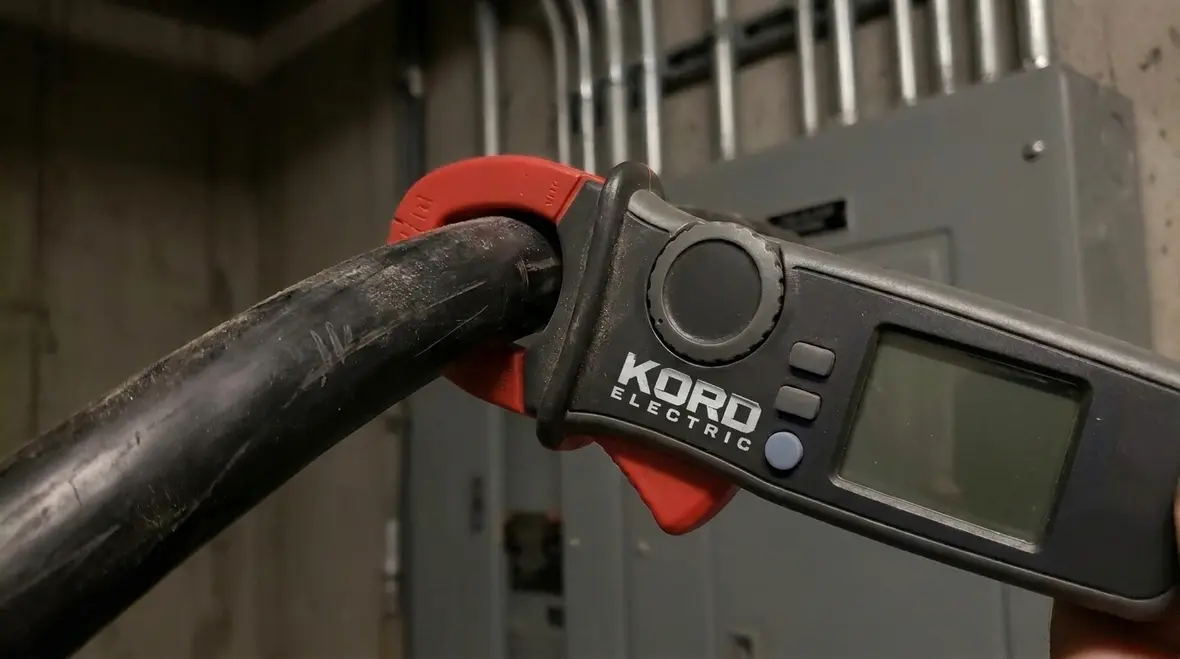 Electrical technician reviewing one-line diagram before commercial load testing