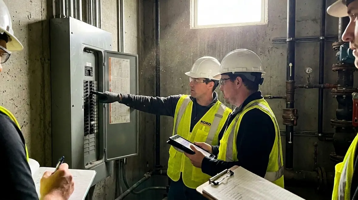 Kord Electric technician walking a facility manager through commercial electrical troubleshooting steps