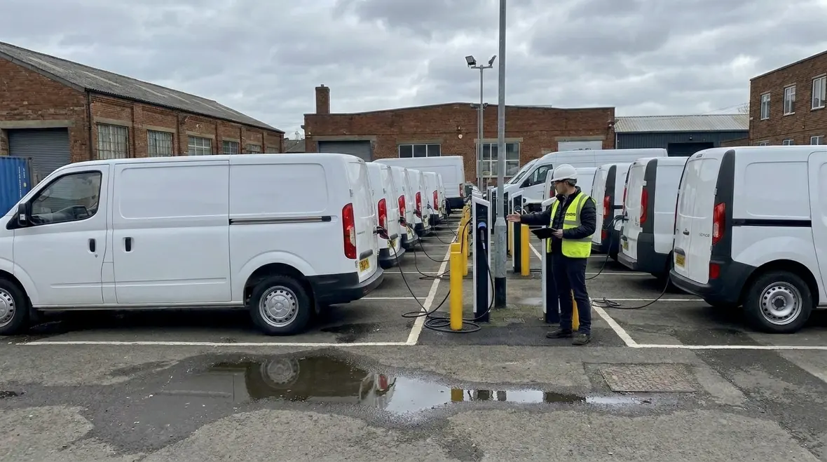 Kord Electric technician reviewing commercial EV charging infrastructure planning on site