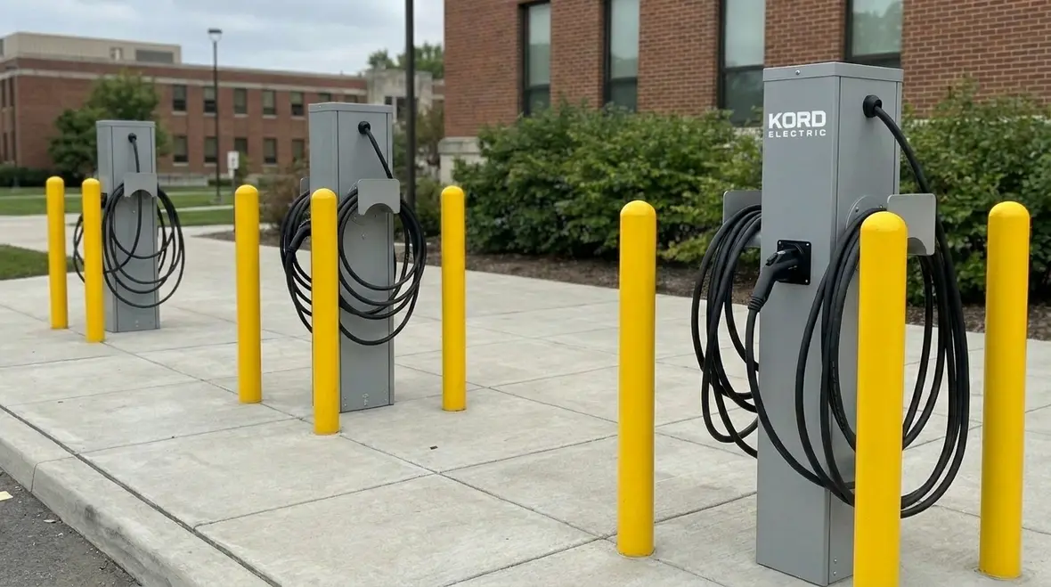 Technicians evaluating commercial power capacity for EV charging