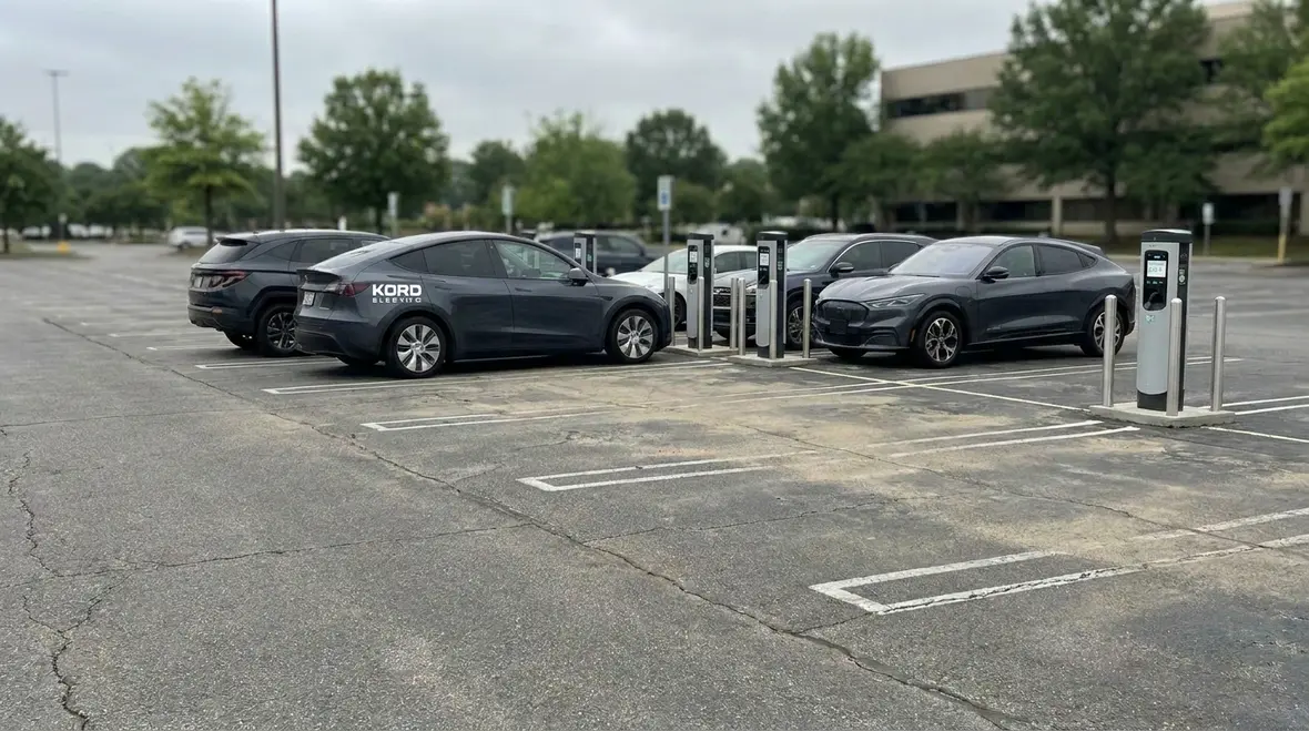 Planning commercial EV charging demand around fleet schedules and parking patterns