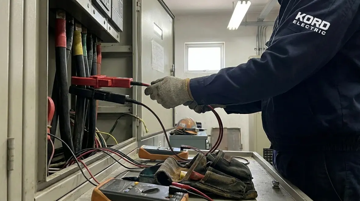 Technicians reviewing power quality data in an industrial manufacturing facility
