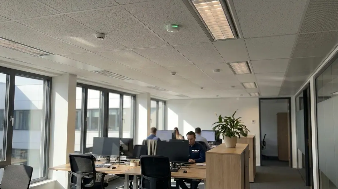 Daylight harvesting and occupancy sensors working together in a commercial office