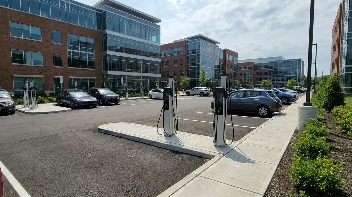Commercial EV charging infrastructure scaling across a modern parking facility