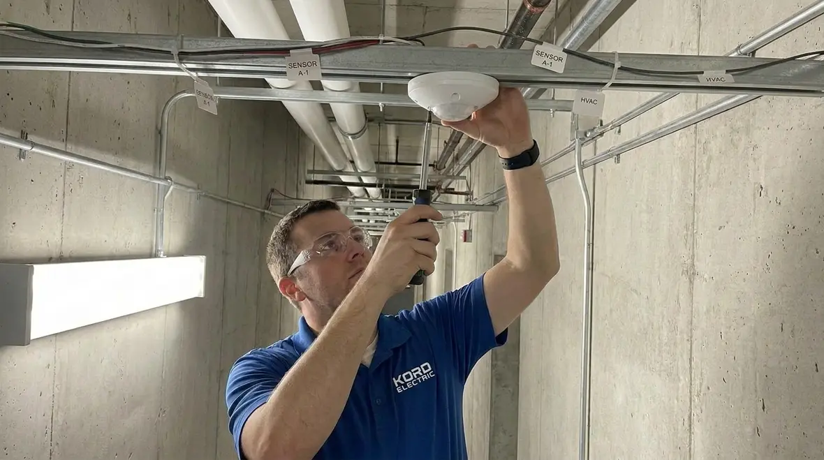 Technician reviewing a Title 24 commercial lighting compliance plan