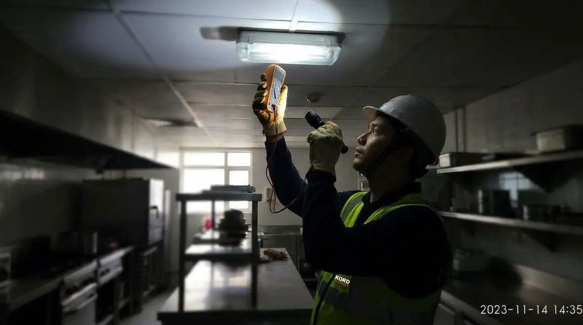 Commercial electrician assessing a business power outage