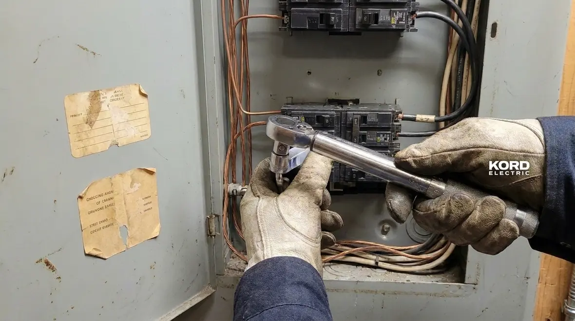 Technician checking panel condition and grounding for factory compliance