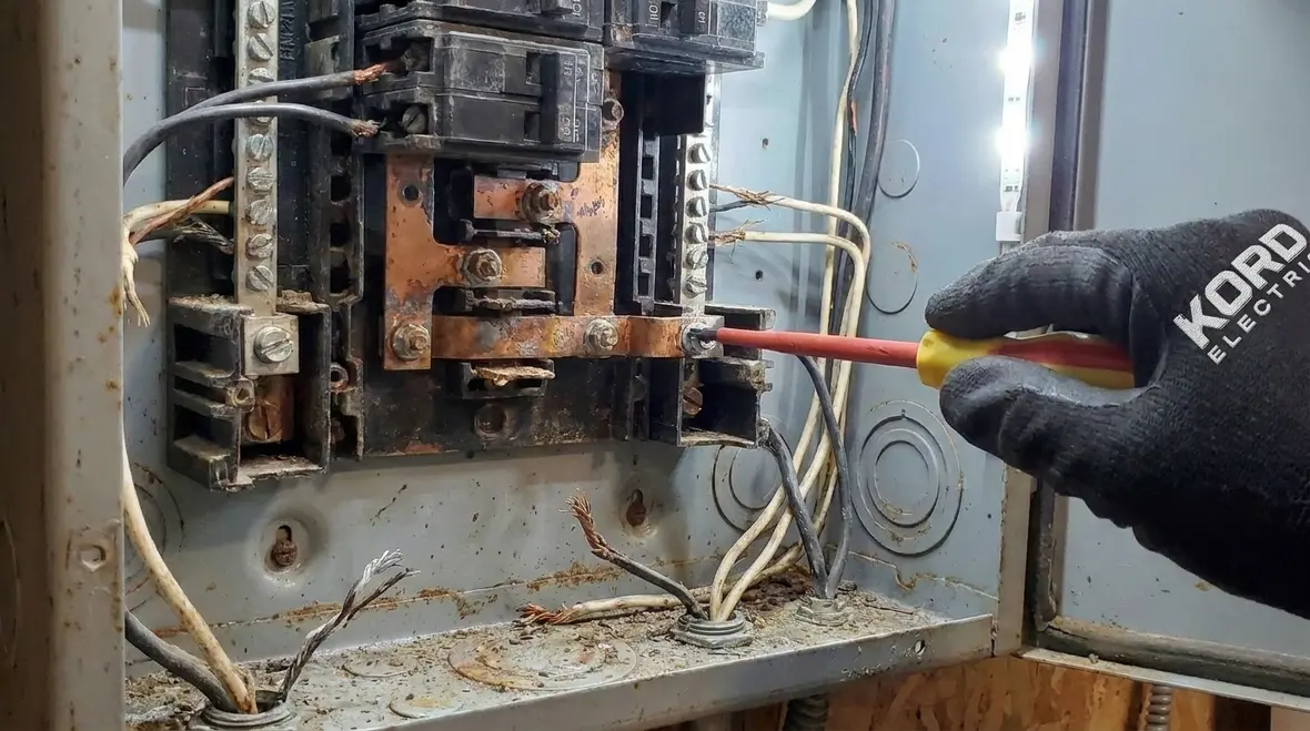 Aging commercial panel with signs of wear and loose connections