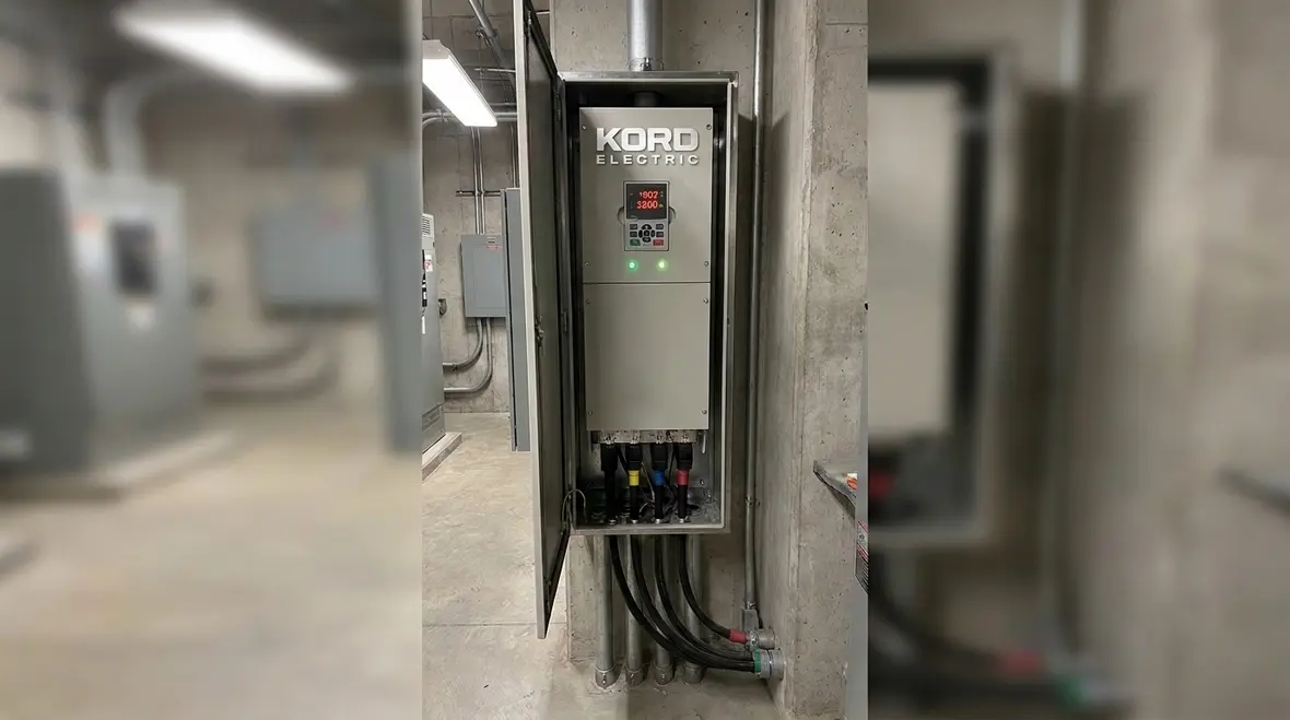 Modern commercial electrical panel with mixed harmonic and overload demands
