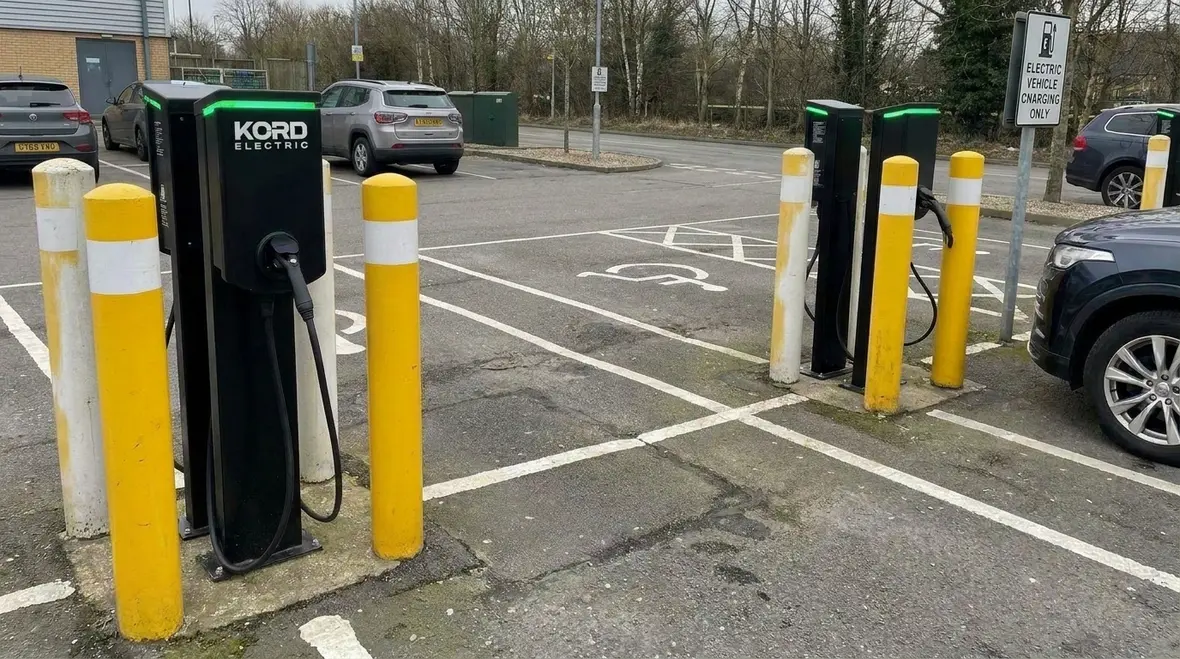 Accessible commercial EV charging layout with signage in California