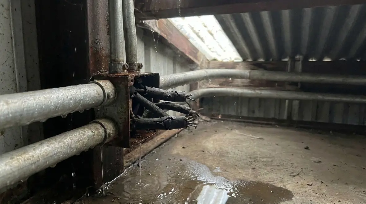 Damaged electrical insulation affected by moisture in a commercial facility