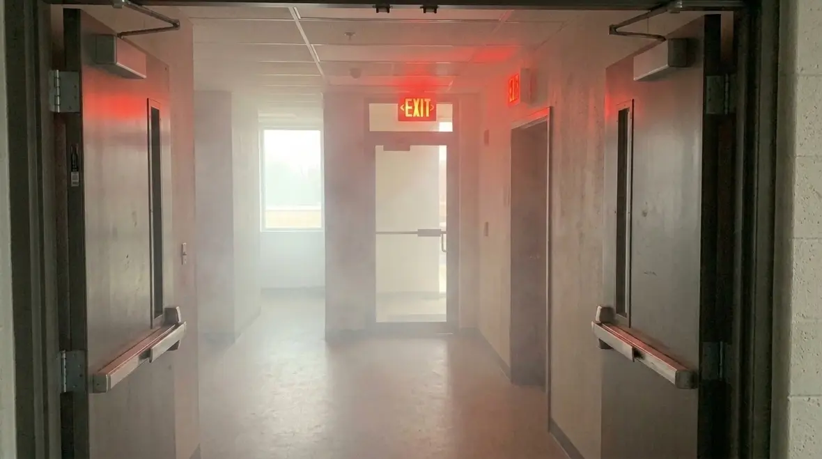 Emergency lighting equipment installed in a California commercial building corridor
