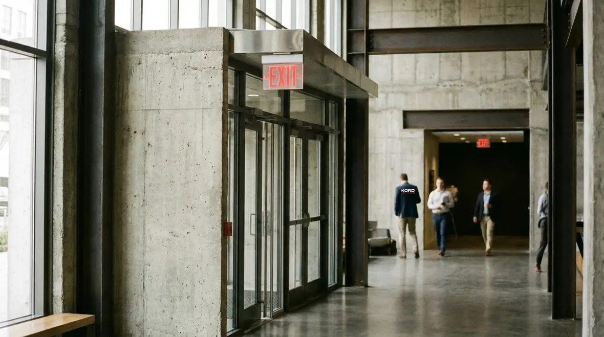 Exit sign requirements California electrical code in commercial hallway