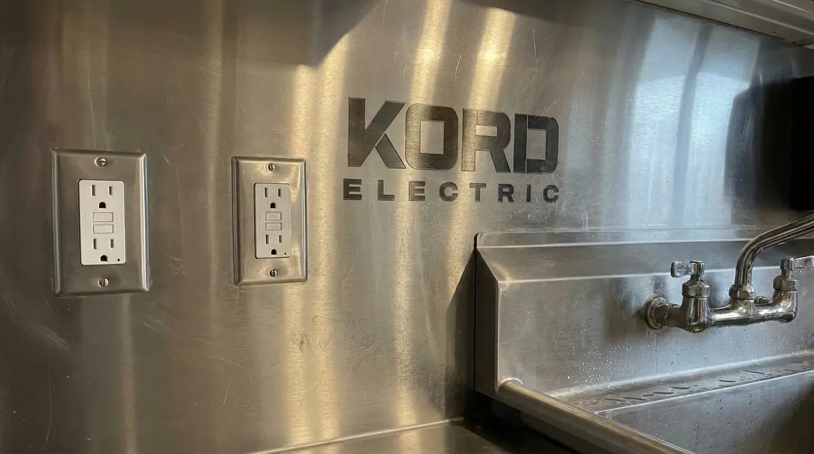 GFCI-protected outlets placed safely in a commercial kitchen wet area