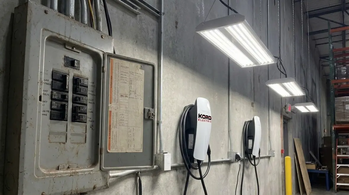 Technician resetting a frequently tripping commercial breaker