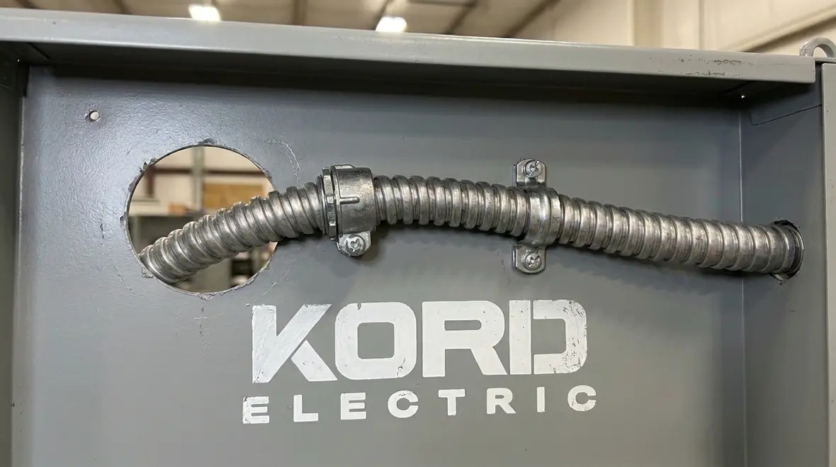 Protected flexible metal conduit routing at an equipment access point