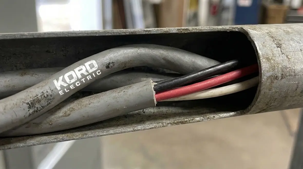 Close-up of NEC SE conductor sheath material protecting service entrance conductors