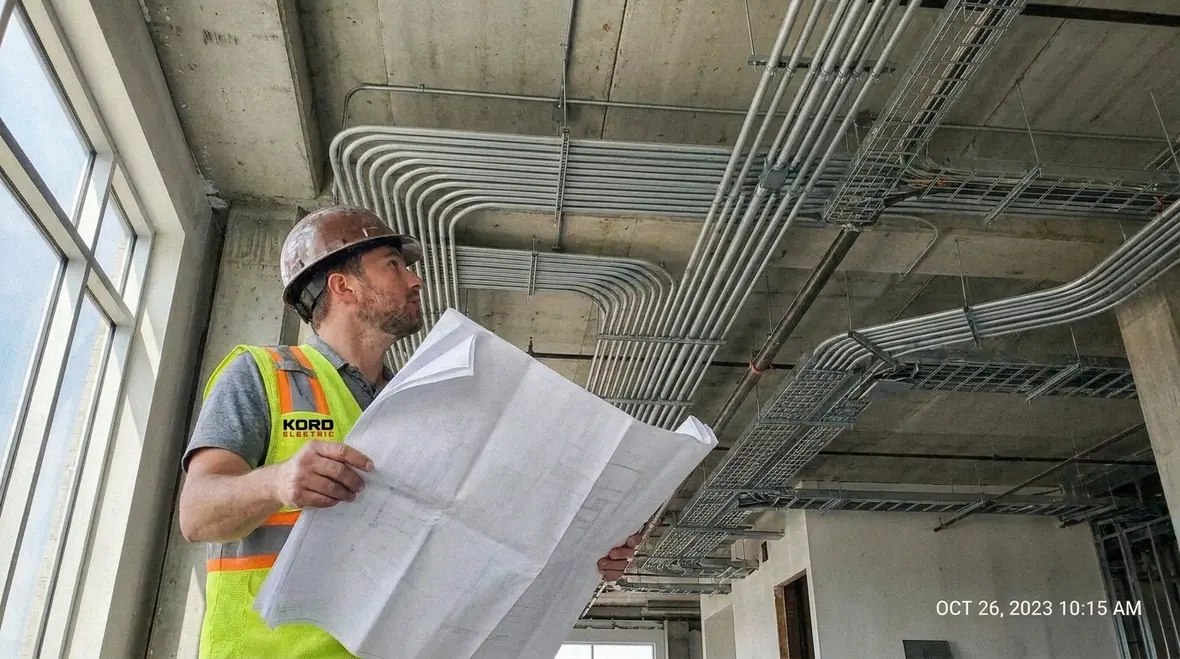 Technicians reviewing NEC Section 645.5 IT equipment room electrical layout