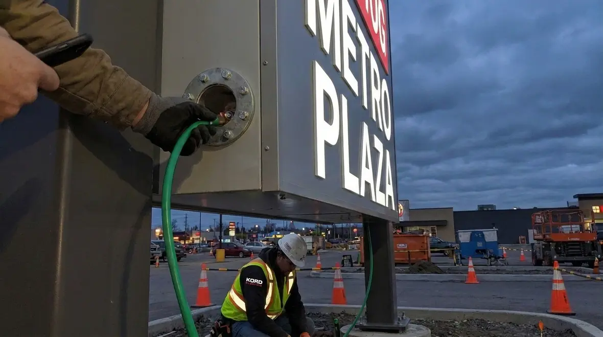 Commercial sign electrical system grounded per NFPA 70 Section 647.7