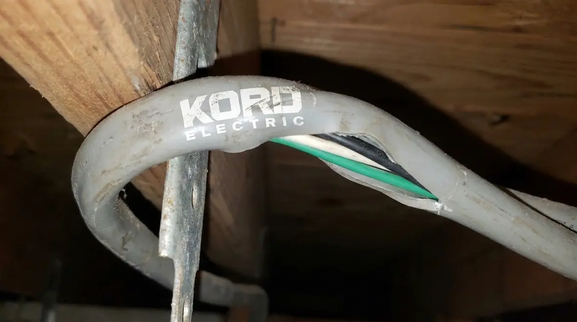Close-up of cable jacket and insulation showing effects of tight bending radius