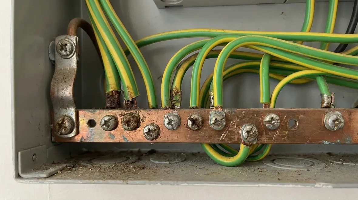 Kord Electric technicians verifying NEC combined disconnect ratings in a commercial facility