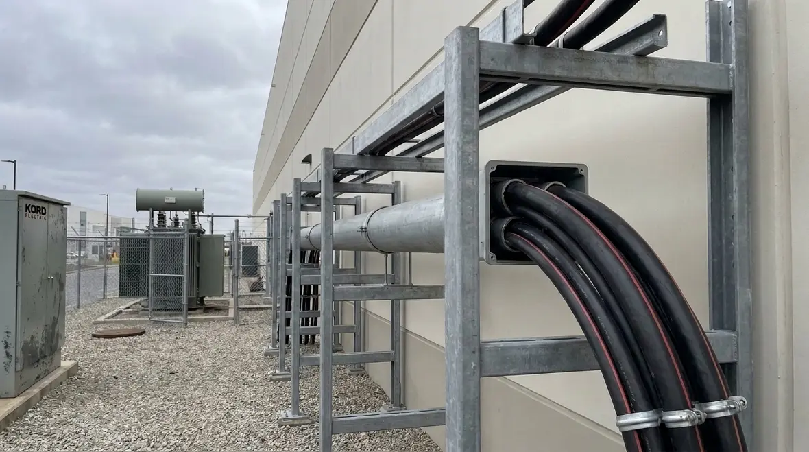 NEC conductors outside building 2 kV