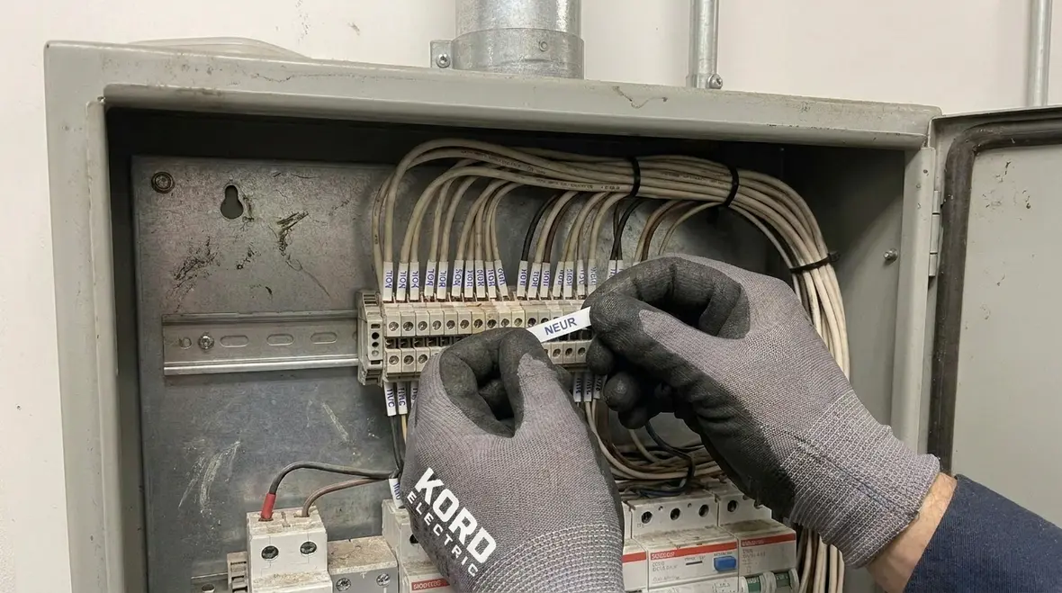 Technician labeling and terminating neutral conductors in an electrical panel