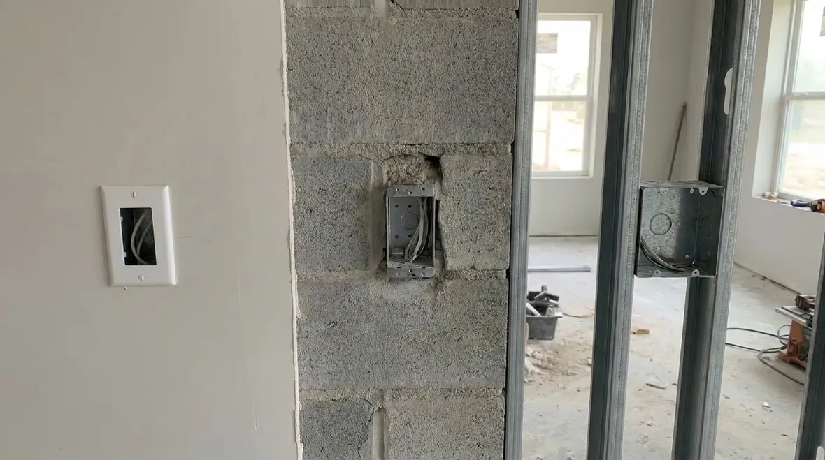 Side view of NEC-compliant flush device box depth in a commercial wall