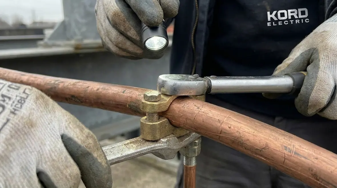 Inspection of grounding electrode connections before concealment in a major property building