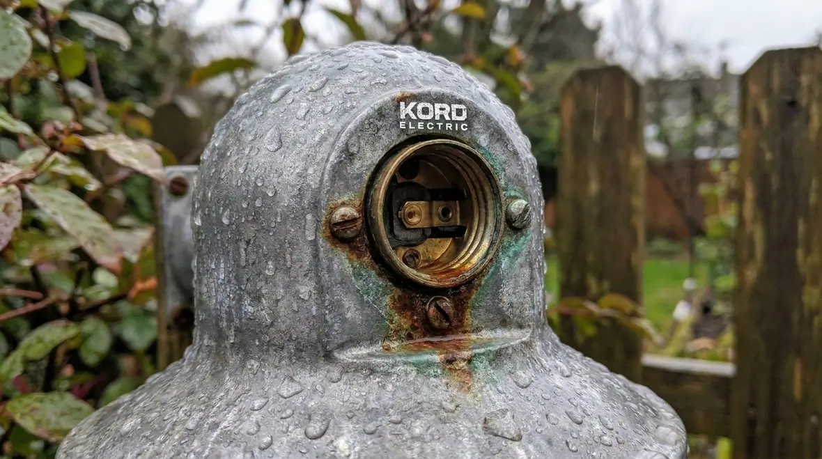 Close-up of sealed outdoor lampholder with proper NEC-compliant mounting