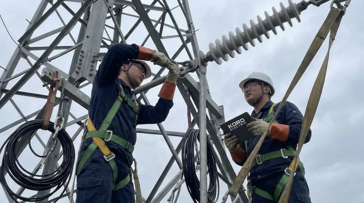 Kord Electric technicians planning NEC-compliant high voltage attachment