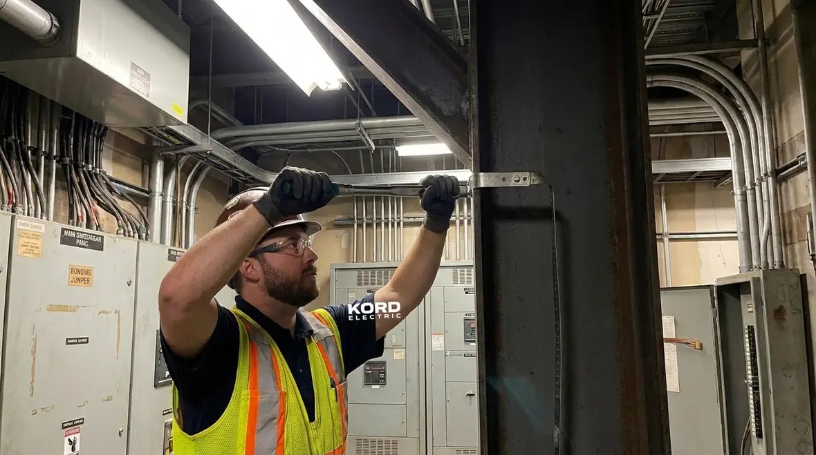 Bonded structural steel and piping forming a controlled fault path in a commercial building