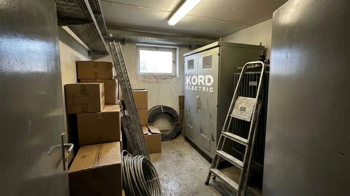 Crowded electrical room showing poor NEC transformer switch working space planning