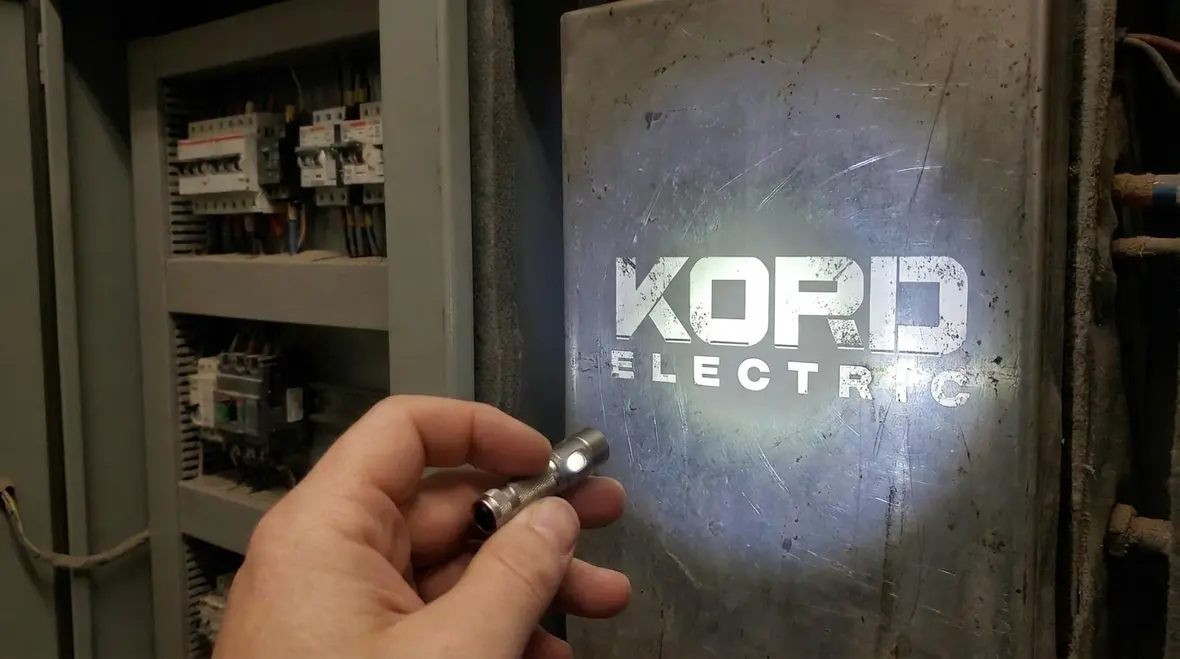 Electricians installing dielectric heating equipment with clear labeling