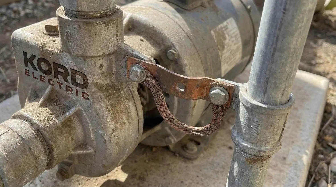 Bonding conductors installed on irrigation pump and piping assemblies