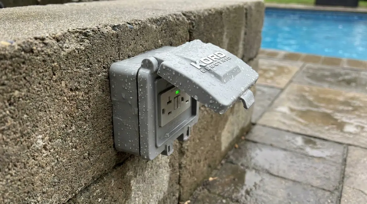 Technician reviewing NEC pool area wiring and receptacle layout