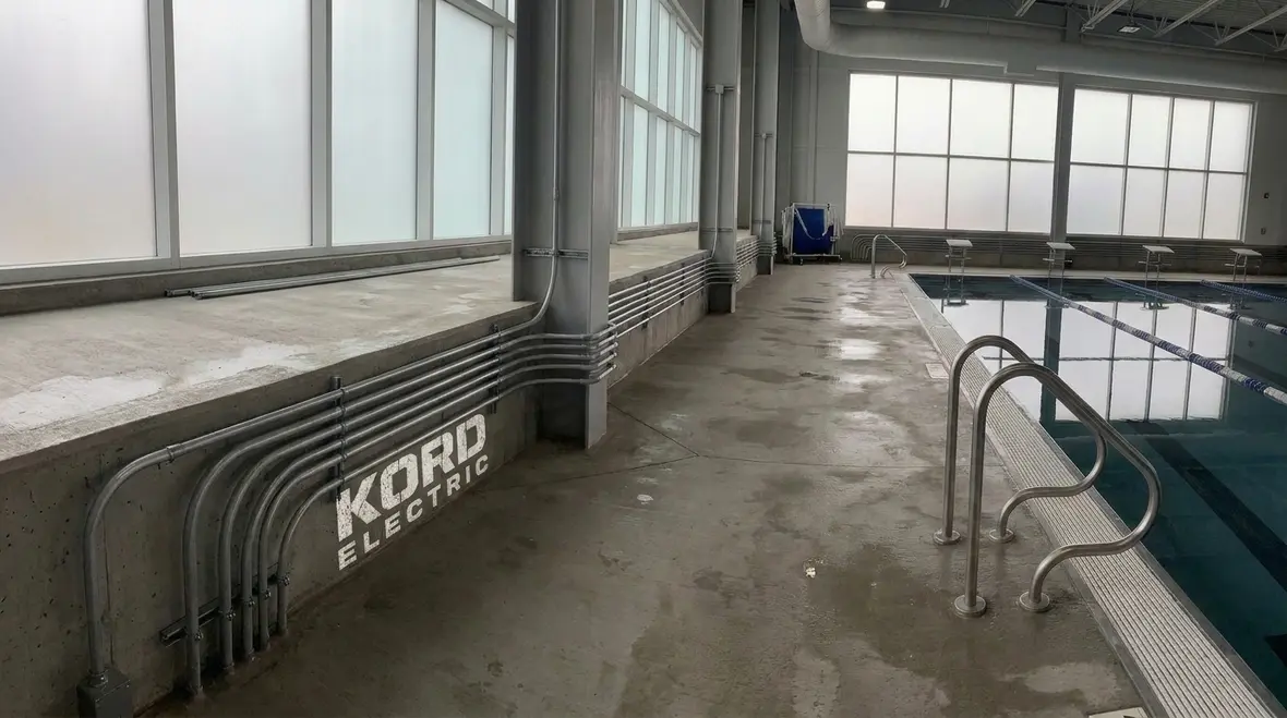 Commercial pool electrical equipment with compliant conductor clearances