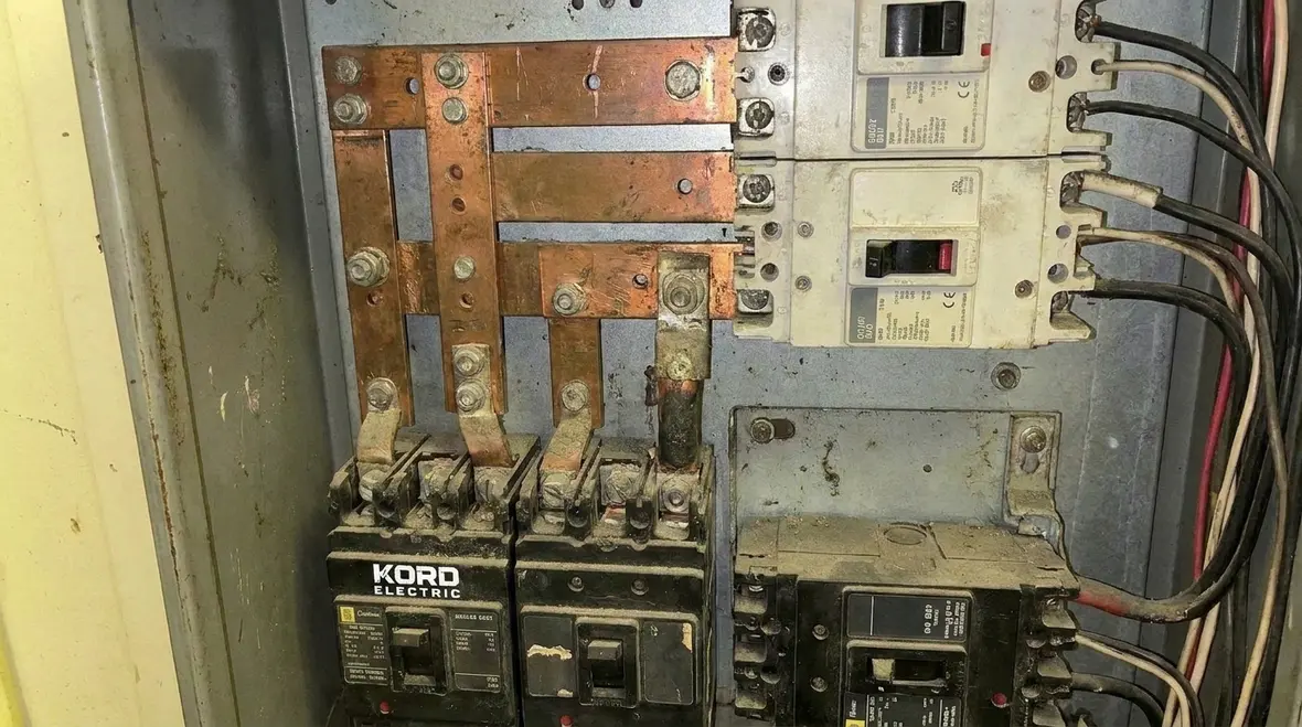 Technicians reviewing time-current curves for selective coordination of MCC overcurrent devices