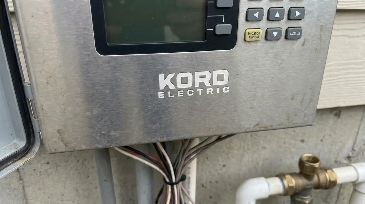 Close-up of labeled irrigation control equipment in line with NEC Section 675.6